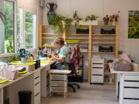 Hand-shaping ceramic flowers in the workshop