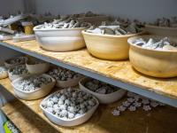 Ceramic flowers before firing in the workshop